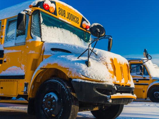 photo of school bus in the winter with snow