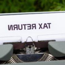 photo of the words tax return on a typewriter