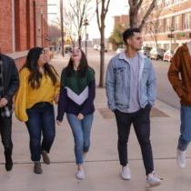 photo of college students waling down sidewalk