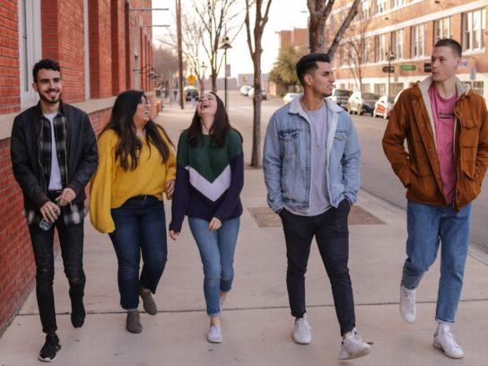 photo of college students waling down sidewalk