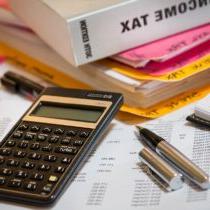 calculator pens and income tax book